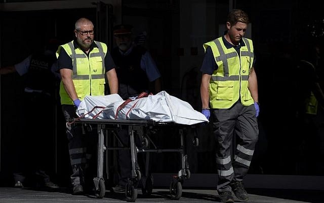 The body of a man who tried to attack a police station is carried out of the premises in Cornella near the northeastern Spanish city of Barcelona on August 20, 2018. (LLUIS GENE/AFP) The body of a man who tried to attack a police station is carried out of the premises in Cornella near the northeastern Spanish city of Barcelona on August 20, 2018. (LLUIS GENE/AFP)
