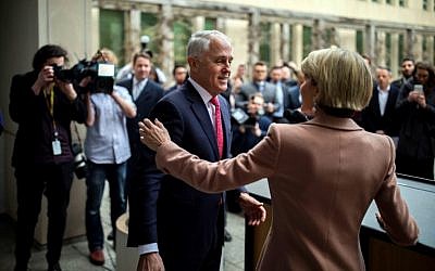 Australia's Malcolm Turnbull, center, and  Julie Bishop, right, leave after a press conference in Canberra on August 21, 2018.
(AFP / SEAN DAVEY)
