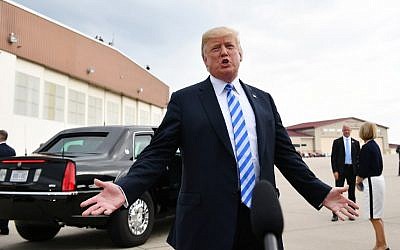 In this photo from August 21, 2018, US President Donald Trump speaks to the press upon arrival at Yeager Airport in Charleston, West Virginia. (AFP Photo/Mandel Ngan)
