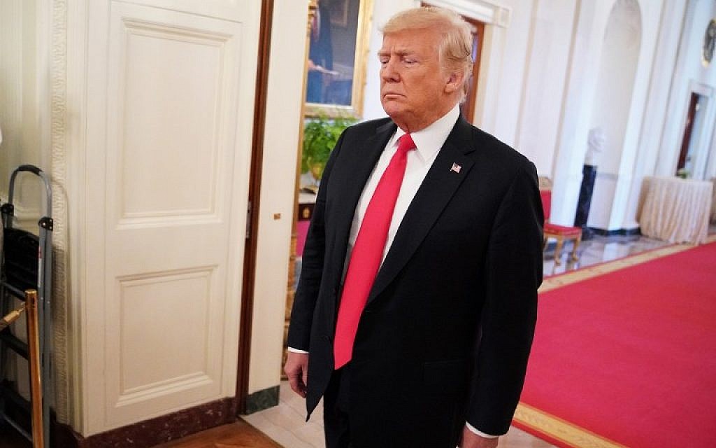 US President Donald Trump arrives for a ceremony to present Valerie Nessel, widow of Air Force Tech Sgt. John Chapman, with his Medal of Honor in the East Room of the White House on August 22, 2018. (AFP Photo/Mandel Ngan)