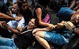 Turkish riot police detains protesters of Saturday mothers group demonstration on August 25, 2018 in Istanbul. (AFP/Yasin AKGUL)