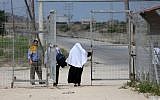 Palestinians are seen crossing at the Erez crossing with Israel near Beit Hanun in the northern Gaza Strip on  August 27, 2018. (AFP Photo/Mahmud Hams)