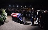 The flag-draped casket of the late US Senator John McCain arrives at the North Phoenix Baptist Church for the memorial service honoring McCain, August 30, 2018 in Phoenix, Arizona.   (AFP / Robyn Beck)