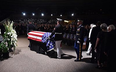 The flag-draped casket of the late US Senator John McCain arrives at the North Phoenix Baptist Church for the memorial service honoring McCain, August 30, 2018 in Phoenix, Arizona.   (AFP / Robyn Beck)