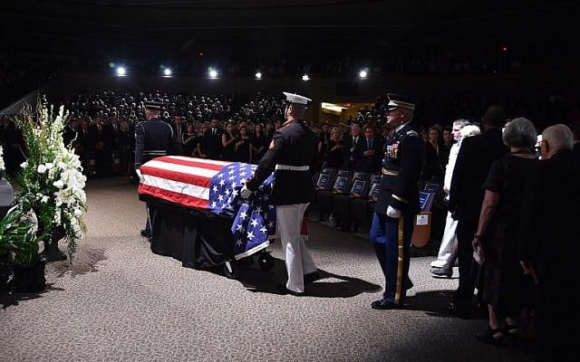 The flag-draped casket of the late US Senator John McCain arrives at the North Phoenix Baptist Church for the memorial service honoring McCain, August 30, 2018 in Phoenix, Arizona. (AFP / Robyn Beck) The flag-draped casket of the late US Senator John McCain arrives at the North Phoenix Baptist Church for the memorial service honoring McCain, August 30, 2018 in Phoenix, Arizona. (AFP / Robyn Beck)
