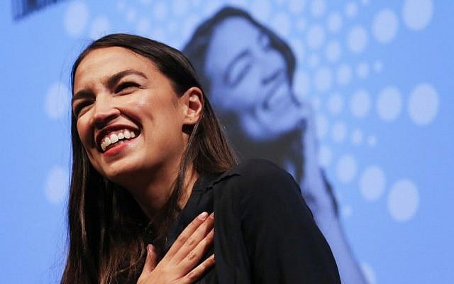 New York US House candidate Alexandria Ocasio-Cortez smiles at a progressive fundraiser on August 2, 2018, in Los Angeles, California. (Mario Tama/Getty Images/AFP) New York US House candidate Alexandria Ocasio-Cortez smiles at a progressive fundraiser on August 2, 2018, in Los Angeles, California. (Mario Tama/Getty Images/AFP)