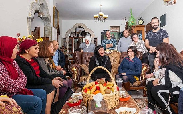 Participants of the Teachers' Lounge coexistence project at the home of an Arab participant in East Jerusalem. (Courtesy: Eyal Tagar) Participants of the Teachers' Lounge coexistence project at the home of an Arab participant in East Jerusalem. (Courtesy: Eyal Tagar)