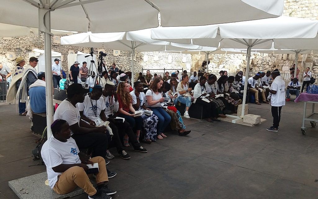 Members of the Ugandan-Jewish Abuyudaya community in Israel on a Birthright trip organized by MAROM participate in a ceremony celebrating the dedication of a new Torah scroll at the Western Wall's pluralistic prayer pavilion, August 27, 2018. (Courtesy MAROM) Members of the Ugandan-Jewish Abuyudaya community in Israel on a Birthright trip organized by MAROM participate in a ceremony celebrating the dedication of a new Torah scroll at the Western Wall's pluralistic prayer pavilion, August 27, 2018. (Courtesy MAROM)