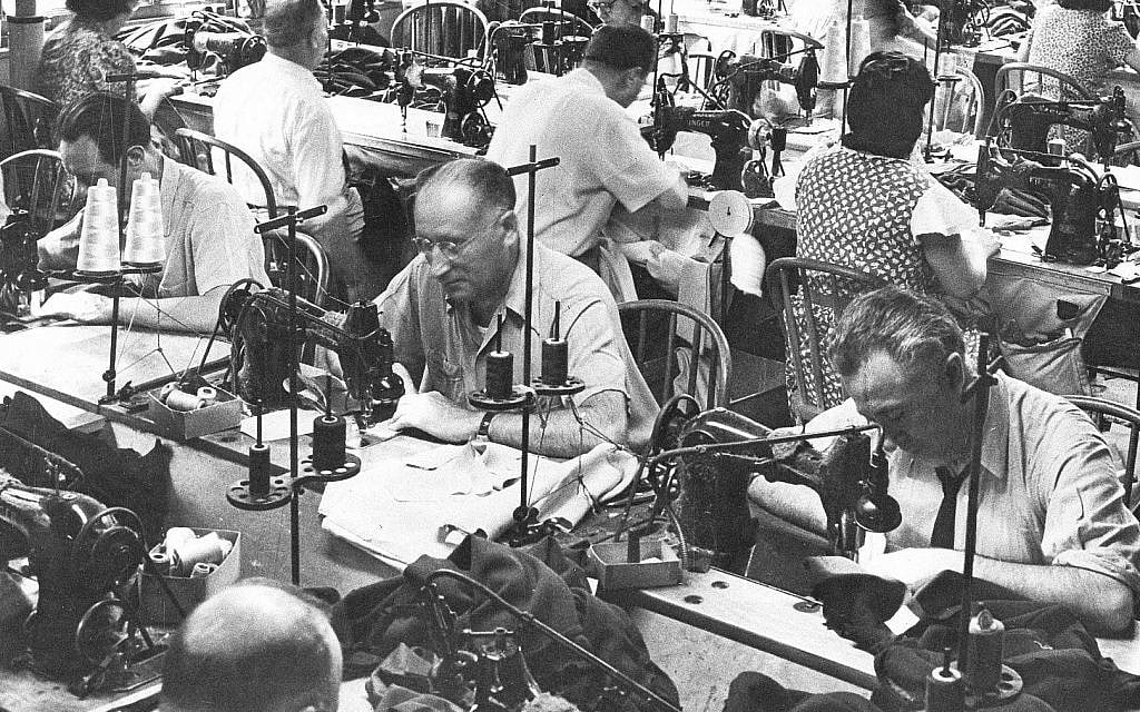 In this June 28, 1944, photo, garment workers sew clothing at a loft factory in New York. (AP Photo)