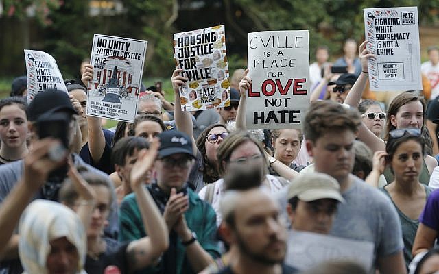 Demonstrators march on the campus of the University of Virginia in anticipation of the anniversary of last year's Unite the Right rally in Charlottesville, Va., Saturday, Aug. 11, 2018. (AP/Steve Helber)
