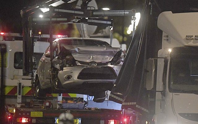 Police recover the car that crashed into security barriers from the scene outside the Houses of Parliament, Westminster in London, August 14, 2018. (Victoria Jones/PA via AP) Police recover the car that crashed into security barriers from the scene outside the Houses of Parliament, Westminster in London, August 14, 2018. (Victoria Jones/PA via AP)