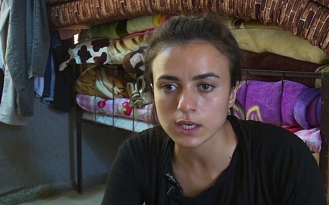 19-year-old Yazidi refugee, Ashwaq Haji Hami talks about her experiences in Germany, saying she has now returned to her homeland of Iraq for fear that her alleged Islamic State tormentor could harm her in Germany, during an interview at Essian refugee camp in Iraq, August 17, 2018. (AP Photo) 19-year-old Yazidi refugee, Ashwaq Haji Hami talks about her experiences in Germany, saying she has now returned to her homeland of Iraq for fear that her alleged Islamic State tormentor could harm her in Germany, during an interview at Essian refugee camp in Iraq, August 17, 2018. (AP Photo)