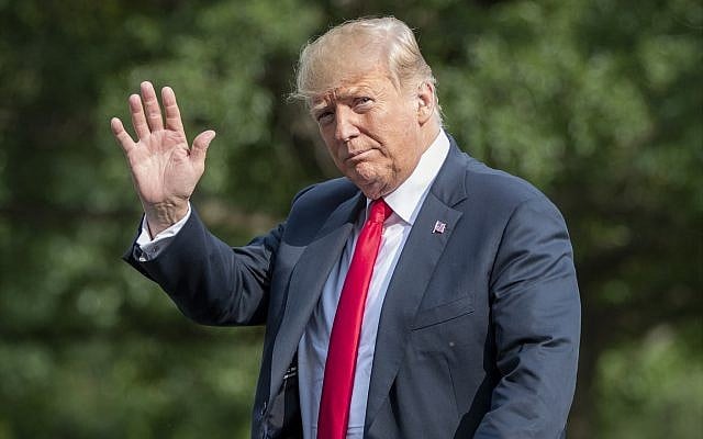 US President Donald Trump waves, as he arrives at the White House in Washington, DC, August 19, 2018, after spending the weekend at his golf club in Bedminster, New Jersey. (AP Photo/J. Scott Applewhite) US President Donald Trump waves, as he arrives at the White House in Washington, DC, August 19, 2018, after spending the weekend at his golf club in Bedminster, New Jersey. (AP Photo/J. Scott Applewhite)
