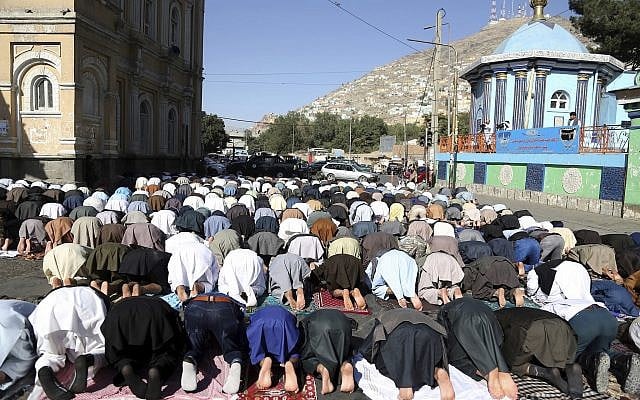Men attend Eid al-Adha prayers outside of the Shah-e-Dushamshera mosque in Kabul, Afghanistan, August 21, 2018. (Rahmat Gul/AP) Men attend Eid al-Adha prayers outside of the Shah-e-Dushamshera mosque in Kabul, Afghanistan, August 21, 2018. (Rahmat Gul/AP)