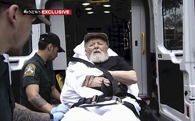 In this Monday, Aug. 20, 2018, frame from video, Jakiw Palij, a former Nazi concentration camp guard, is carried on a stretcher from his home in the Queens borough of New York. (ABC via AP)