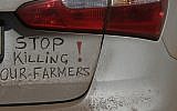 In this photo from October 30 2017, a bumper sign calls for the end of farm killings in South Africa, during a blockade of a freeway in Midvaal, South Africa. (AP Photo/Themba Hadebe, File)