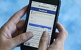 In this file photo dated August 21, 2018, a Facebook start page is shown on a smartphone in Surfside, Florida, USA. (AP Photo/Wilfredo Lee, FILE)