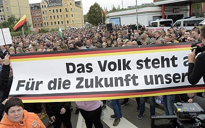 People gather for a far-right demonstration in Chemnitz, Germany, Thursday, Aug. 30, 2018. (AP/Jens Meyer)