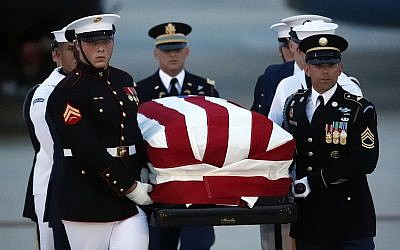 The flag-draped casket of Sen. John McCain, R-Ariz., is carried by an Armed Forces body bearer team to a hearse, Thursday, Aug. 30, 2018, at Andrews Air Force Base, Md. (AP/Alex Brandon)