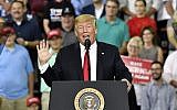 US President Donald Trump speaks to a group of supporters at the Ford Center in Evansville, Ind., Thursday, Aug. 30, 2018. (AP Photo/Timothy D. Easley)
