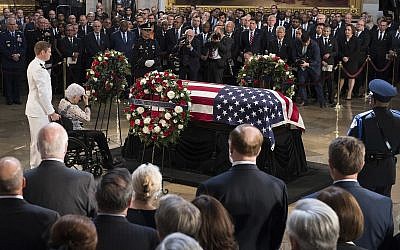 Roberta McCain, the 106-year-old mother of Sen. John McCain, R-Ariz., pays her respects to the flag-draped casket bearing the remains of her son, Friday, Aug. 31, 2018 in the US Capitol in Washington. (Jim Watson/Pool photo via AP)