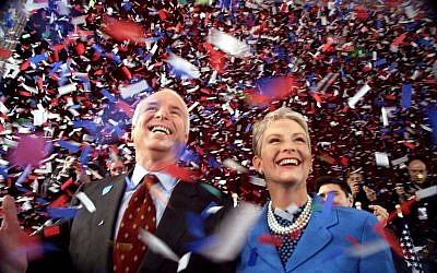 In this Jan. 30, 2000 file photo, Republican presidential hopeful, Sen. John McCain, R-Ariz., and his wife Cindy, smile as confetti falls on them at the end of their 114th New Hampshire town hall meeting with voters at the Peterborough Town House in Peterborough, N.H. (AP/Stephan Savoia)