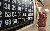 Illustrative: Bingo Chairman Mike Muldoon removes old instructions from a game board at the Elks Lodge in Hot Springs, Ark., on July 27, 2007. (AP Photo/Danny Johnston)