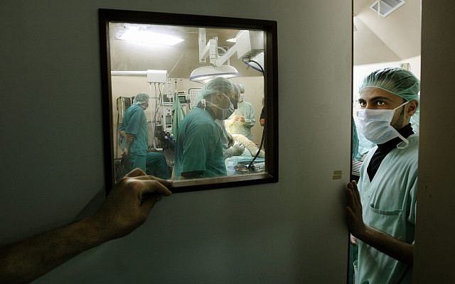 illustrative: A Palestinian doctor exits an operating theater in the Shifa hospital in Gaza City, Tuesday, January 27, 2009. (Illustrative photo: AP/Anja Niedringhaus) illustrative: A Palestinian doctor exits an operating theater in the Shifa hospital in Gaza City, Tuesday, January 27, 2009. (Illustrative photo: AP/Anja Niedringhaus)