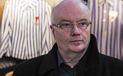 Volkhard Knigge, foundation director of the Nazi concentration camp Buchenwald memorial place, stands in front of vitrines with concentration camp inmates' uniforms near Weimar, central Germany, April 13, 2016. (AP Photo/Jens Meyer)