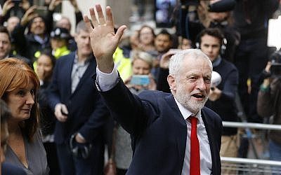Britain's Labour leader Jeremy Corbyn waves as he arrives at party headquarters in London, Friday, June 9, 2017, after the general elections (AP Photo/Frank Augstein)