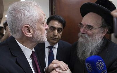 Illustrative: Labour leader Jeremy Corbyn, left, meets locals at Finsbury Park Mosque in north London, after an incident where where a van struck pedestrians, in London, Monday June 19, 2017. (Stefan Rousseau/Pool Photo via AP)