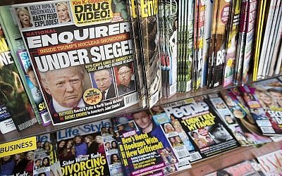 In this Wednesday, July 12, 2017 photo, an issue of the National Enquirer featuring President Donald Trump on it's cover is seen at a store in New York. (AP Photo/Mary Altaffer)