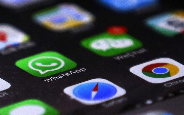WhatsApp is seen with other mobile apps on a smartphone (AP Photo/Andy Wong)