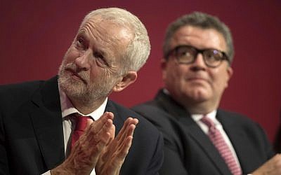 Labour Party leader Jeremy Corbyn, left, and deputy leader Tom Watson attend the opening session of the Labour Party annual conference in Brighton, England, September 24, 2017. (Stefan Rousseau/PA via AP)
