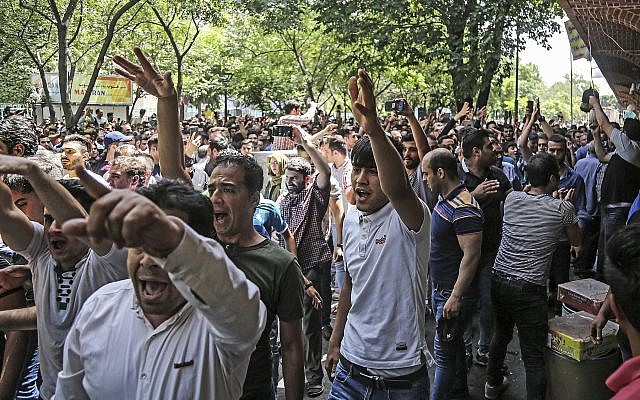 Illustrative: People protest the state of Iran's economy at the old grand bazaar in Tehran, Iran, Monday, June 25, 2018 (Iranian Labor News Agency via AP) Illustrative: People protest the state of Iran's economy at the old grand bazaar in Tehran, Iran, Monday, June 25, 2018 (Iranian Labor News Agency via AP)
