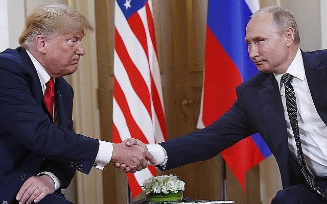 US President Donald Trump and Russian President Vladimir Putin shake hands at the beginning of a meeting at the Presidential Palace in Helsinki, Finland, Monday, July 16, 2018. (AP Photo/Pablo Martinez Monsivais)