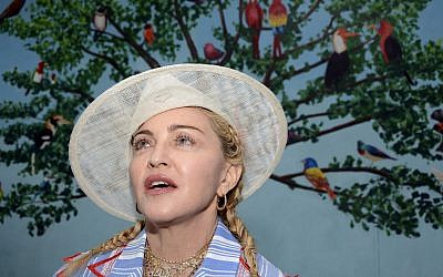 Madonna speaks to the press at a news conference in Blantyre, Malawi, July 16, 2018. (AP Photo/Thoko Chikondi)