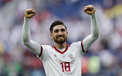In this June 15, 2018 photo, Iran's Alireza Jahanbakhsh celebrates his team's victory after the group B match between Morocco and Iran at the 2018 soccer World Cup in the St. Petersburg Stadium in St. Petersburg, Russia. (AP Photo/Themba Hadebe)