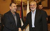 Ismail Haniyeh, right, the head of the Hamas political bureau, shakes hands with his deputy Saleh al-Arouri, upon his arrival in Gaza from Cairo, Egypt, in Gaza City, August 2, 2018. (Mohammad Austaz/Hamas Media Office via AP)