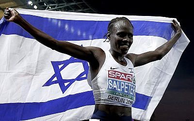 Israel's Lonah Chemtai Salpeter celebrates winning the women's 10,000 meter final race at the European Athletics Championships in Berlin, Germany, August 8, 2018. (AP Photo/Michael Sohn)
