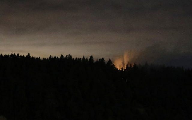 In this long-exposure photo, smoke and an orange glow are seen on Ketron Island in Washington state, early Saturday, Aug. 11, 2018 as viewed from near Steilacoom, Washington. (AP Photo/Ted S. Warren) In this long-exposure photo, smoke and an orange glow are seen on Ketron Island in Washington state, early Saturday, Aug. 11, 2018 as viewed from near Steilacoom, Washington. (AP Photo/Ted S. Warren)