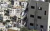 A wing of a building is seen collapsed in Salt, Jordan, August 12, 2018. (AP Photo/Raad Adayleh)