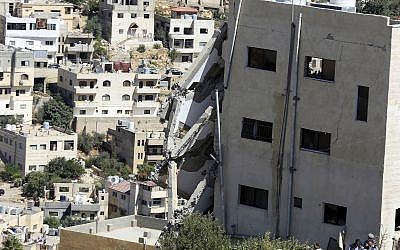 A wing of a building is seen collapsed in Salt, Jordan, August 12, 2018. (AP Photo/Raad Adayleh) A wing of a building is seen collapsed in Salt, Jordan, August 12, 2018. (AP Photo/Raad Adayleh)