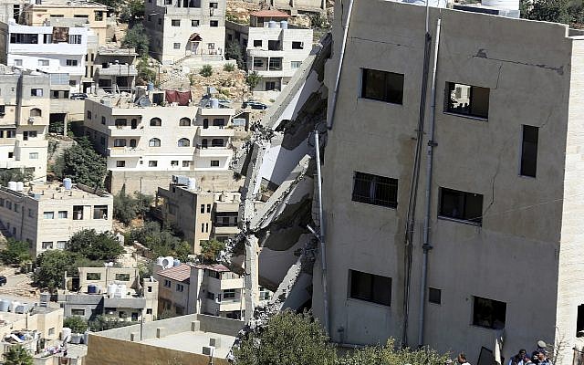 A wing of a building is seen collapsed in Salt, Jordan, August 12, 2018. (AP Photo/Raad Adayleh) A wing of a building is seen collapsed in Salt, Jordan, August 12, 2018. (AP Photo/Raad Adayleh)