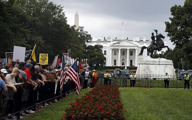 Demonstrators rally near the White House on the one year anniversary of the Charlottesville "Unite the Right" rally, Sunday, Aug. 12, 2018, in Washington. (AP/Jacquelyn Martin) Demonstrators rally near the White House on the one year anniversary of the Charlottesville "Unite the Right" rally, Sunday, Aug. 12, 2018, in Washington. (AP/Jacquelyn Martin)