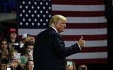 US President Donald Trump gives a thumbs up after speaking during a rally, August 21, 2018, in Charleston, West Virginia. (AP Photo/Alex Brandon)