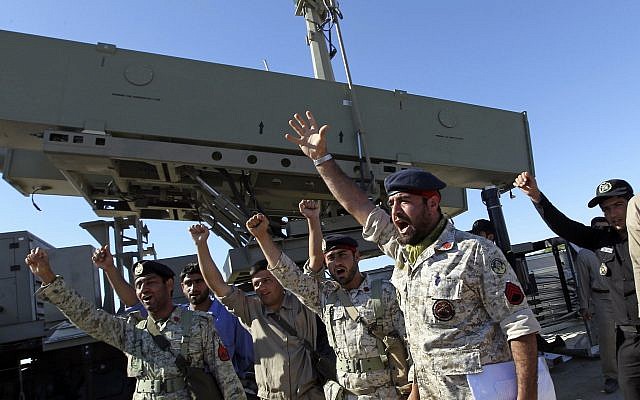 Illustrative: Iranian navy personnel celebrate after successfully launching a Ghader missile from the Jask port area on the shores of the Gulf of Oman during a drill near the Strait of Hormuz, Tuesday, January 1, 2013. (AP/Jamejam Online, Azin Haghighi) Illustrative: Iranian navy personnel celebrate after successfully launching a Ghader missile from the Jask port area on the shores of the Gulf of Oman during a drill near the Strait of Hormuz, Tuesday, January 1, 2013. (AP/Jamejam Online, Azin Haghighi)