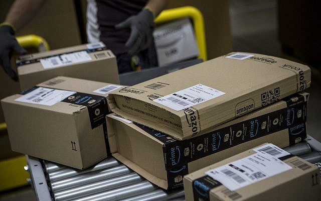 Parcels are processed and prepared for dispatch at the Amazon.com fulfillment center in Amazon.com MPX5 fulfillment center on November 17, 2017 in Castel San Giovanni, Italy. (Emanuele Cremaschi/Getty Images via JTA) Parcels are processed and prepared for dispatch at the Amazon.com fulfillment center in Amazon.com MPX5 fulfillment center on November 17, 2017 in Castel San Giovanni, Italy. (Emanuele Cremaschi/Getty Images via JTA)