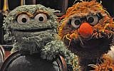 Oscar the Grouch, left, and his Israeli cousin Moishe Oofnik visited the Jewish federations’ General Assembly in New Orleans to promote 'Shalom Sesame,' a version of 'Sesame Street' created for Israel’s Educational Television channel, November 2010. (Daniel Sieradski via JTA)