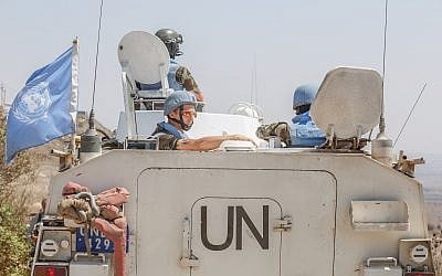 Members of the United Nations Disengagement Observer Force (UNDOF) enter Syria from the Quneitra crossing between Israel and Syria on August 30, 2014. (Flash90)